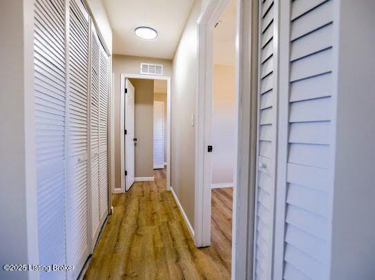 hall with light wood-type flooring