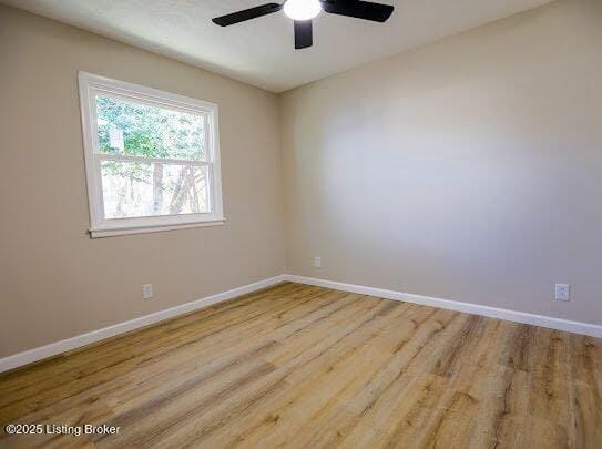 empty room featuring light hardwood / wood-style floors and ceiling fan