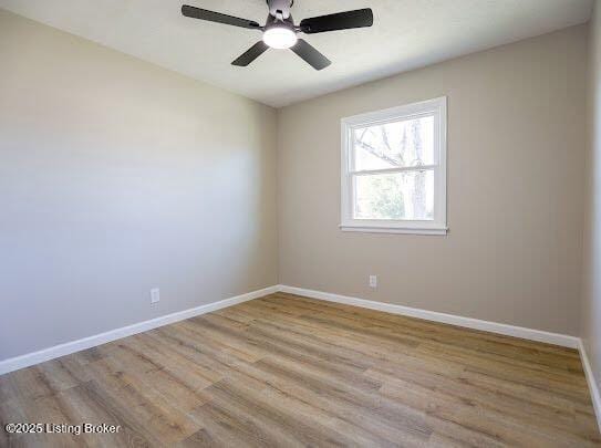 empty room featuring ceiling fan and light hardwood / wood-style flooring