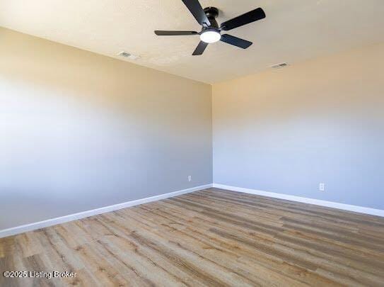 spare room with light hardwood / wood-style floors and ceiling fan