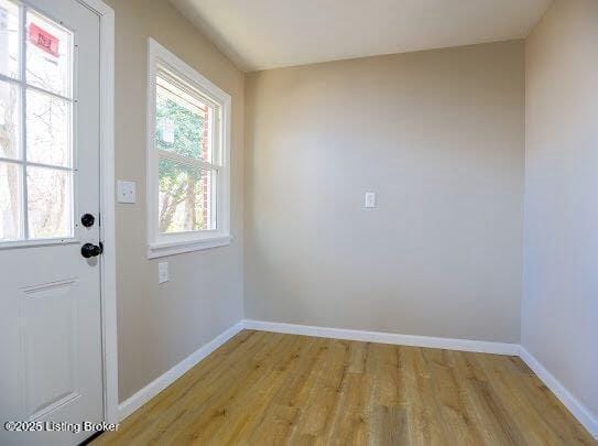 doorway to outside with light hardwood / wood-style flooring