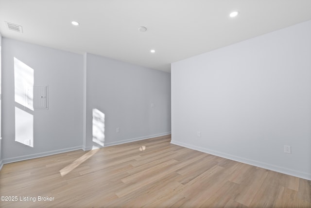 spare room with light hardwood / wood-style flooring