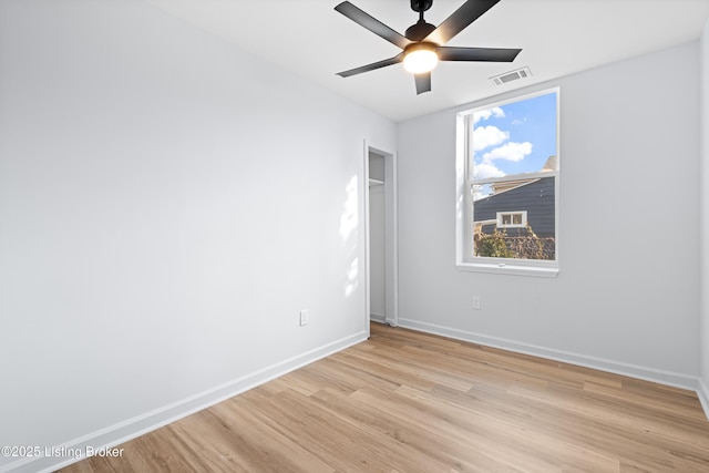 unfurnished room with ceiling fan and light hardwood / wood-style floors