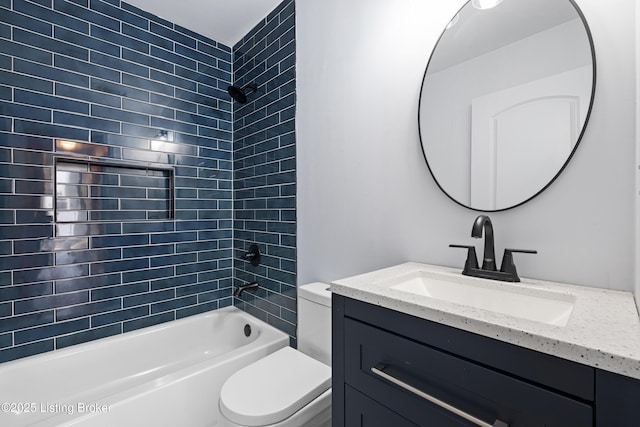 full bathroom featuring vanity, toilet, and tiled shower / bath combo