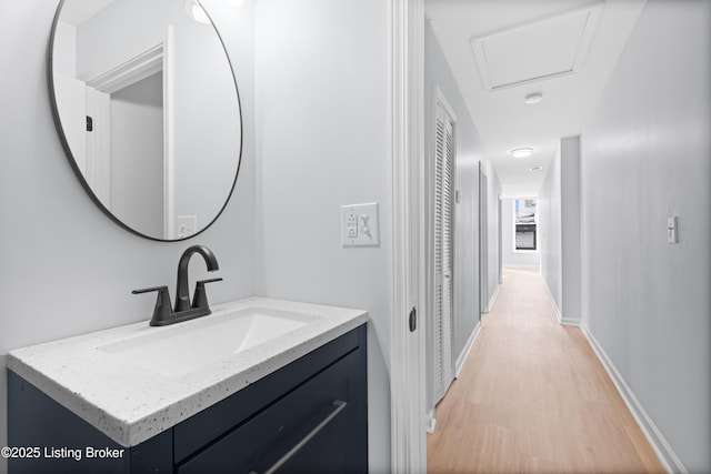 bathroom featuring vanity and hardwood / wood-style floors