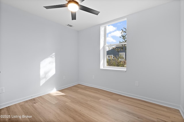 spare room featuring ceiling fan and light hardwood / wood-style flooring