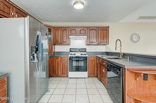 kitchen featuring stainless steel fridge with ice dispenser, sink, dishwasher, white range with gas stovetop, and light tile patterned flooring