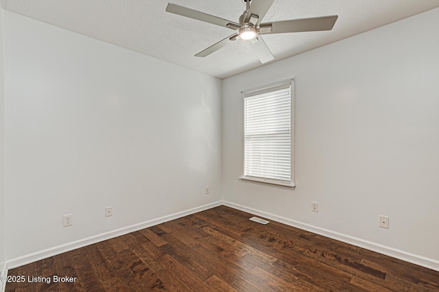 empty room featuring a textured ceiling, ceiling fan, and dark hardwood / wood-style flooring