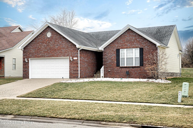 view of front of property with a garage and a front yard