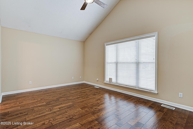 empty room with ceiling fan, dark wood-type flooring, and lofted ceiling