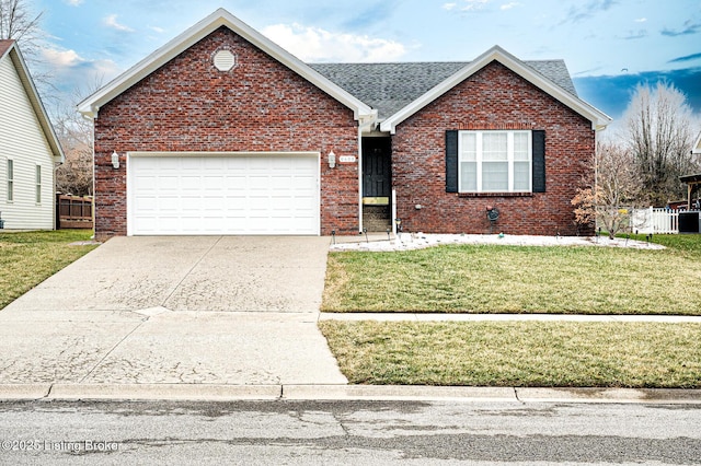 view of front facade with a garage and a front yard