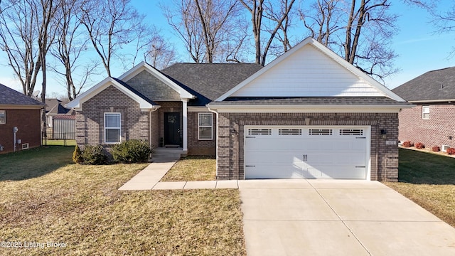 view of front of home with a garage and a front lawn