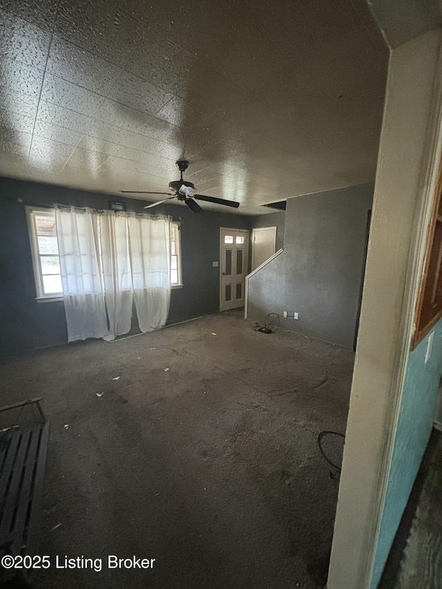 spare room featuring a wealth of natural light and ceiling fan