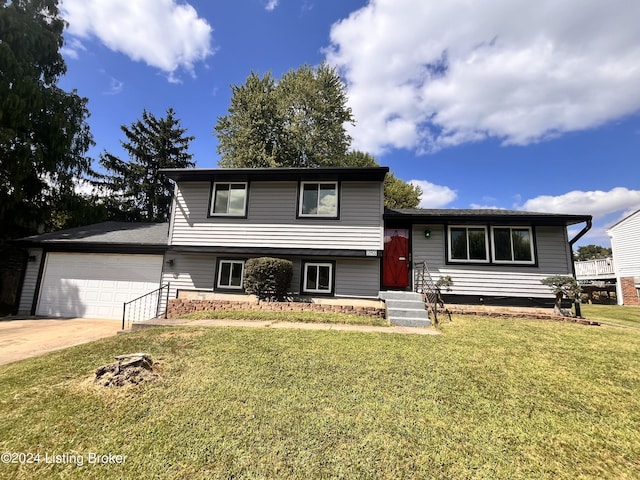 split level home featuring a garage and a front yard