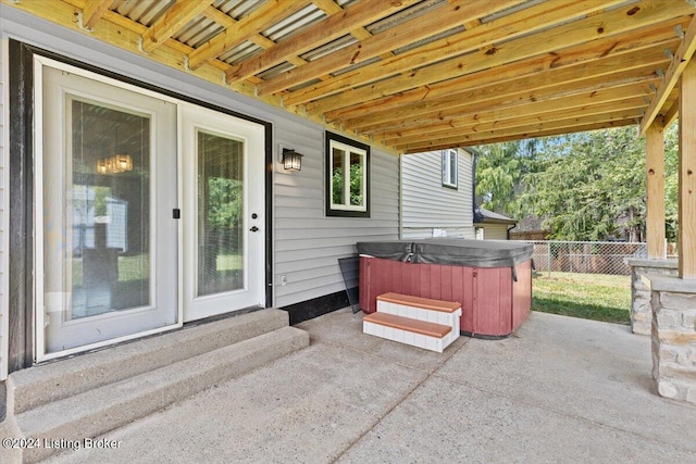 view of patio / terrace featuring a hot tub