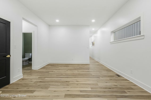 spare room featuring light wood-type flooring