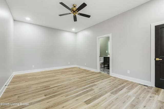 unfurnished room featuring ceiling fan and light wood-type flooring