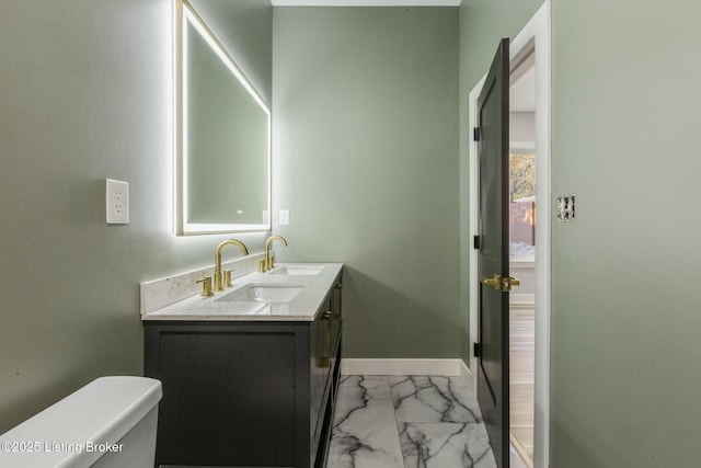 bathroom with vanity and toilet