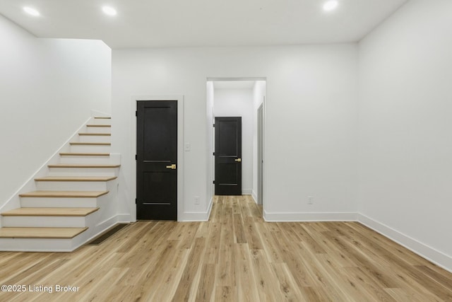 spare room featuring light hardwood / wood-style floors