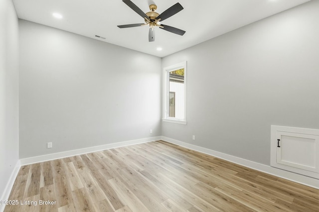 unfurnished room with ceiling fan and light wood-type flooring