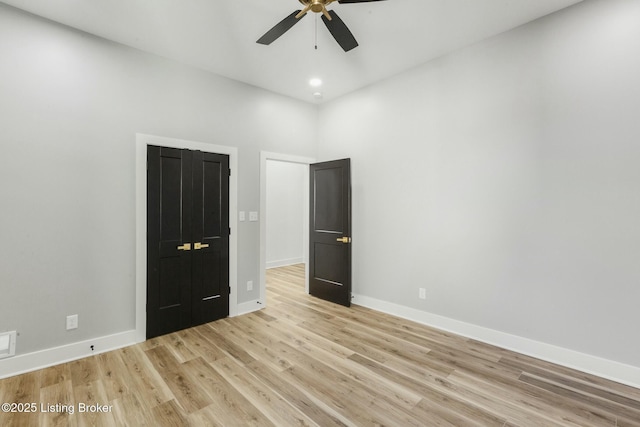 unfurnished bedroom featuring light hardwood / wood-style flooring and ceiling fan