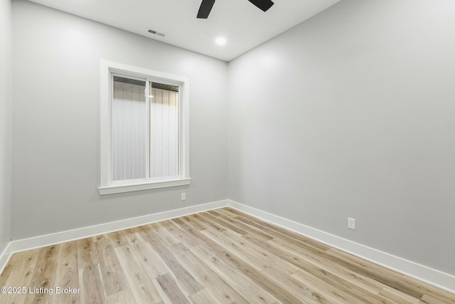 empty room featuring ceiling fan and light hardwood / wood-style flooring