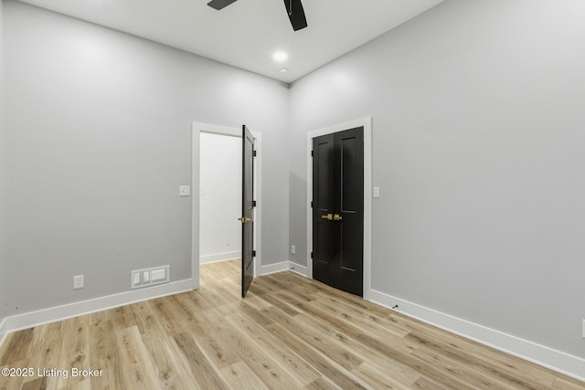 spare room with ceiling fan and light hardwood / wood-style flooring