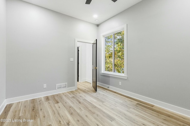 unfurnished room featuring ceiling fan and light hardwood / wood-style flooring