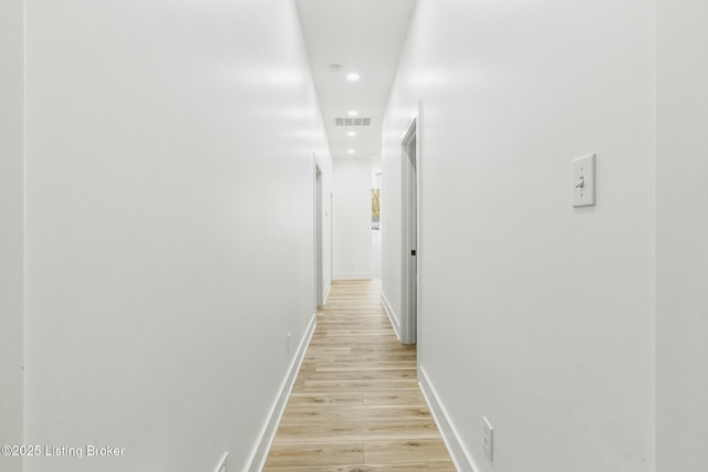 corridor featuring light hardwood / wood-style flooring