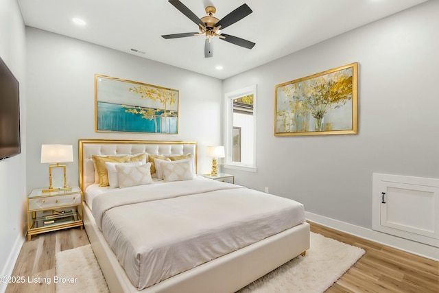 bedroom with ceiling fan and light wood-type flooring