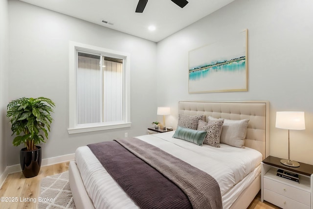 bedroom featuring ceiling fan and light hardwood / wood-style floors