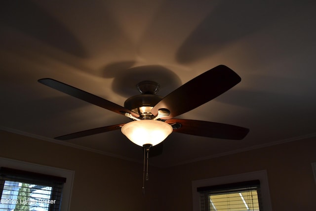 interior details with ceiling fan and ornamental molding