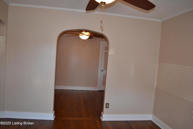 spare room with crown molding, dark hardwood / wood-style floors, and ceiling fan