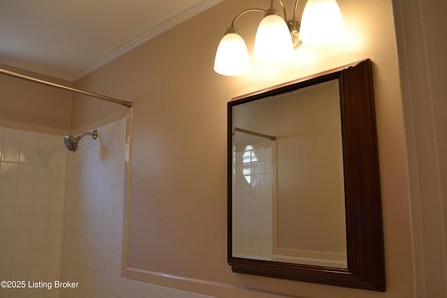 bathroom featuring tiled shower and ornamental molding