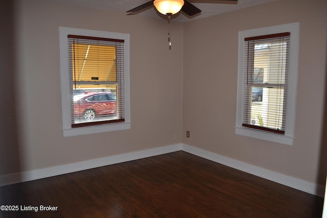 unfurnished room featuring ceiling fan and dark hardwood / wood-style flooring