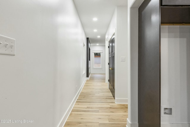 hallway with light wood-type flooring