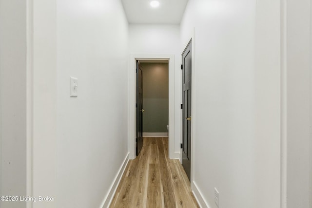 corridor featuring light hardwood / wood-style floors