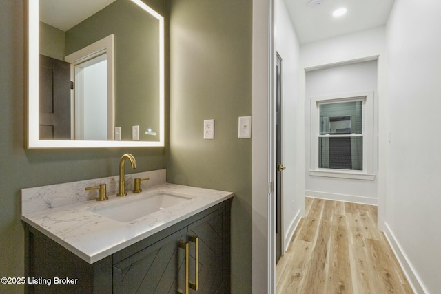 bathroom featuring vanity and hardwood / wood-style floors