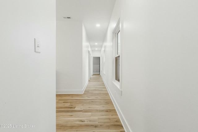 corridor featuring light hardwood / wood-style flooring