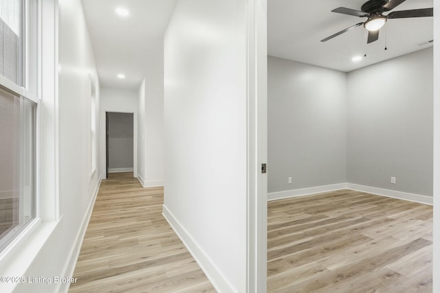 hall with light wood-type flooring