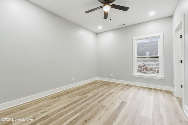 empty room with light hardwood / wood-style flooring and ceiling fan