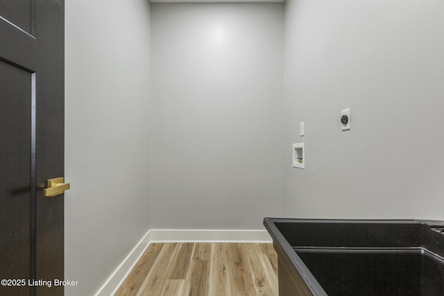 washroom featuring hardwood / wood-style floors, electric dryer hookup, and washer hookup