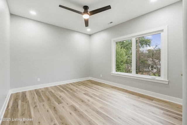 unfurnished room featuring light hardwood / wood-style flooring and ceiling fan