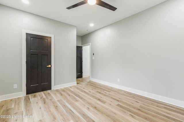 spare room featuring ceiling fan and light hardwood / wood-style floors