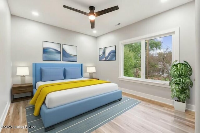 bedroom featuring ceiling fan and light wood-type flooring