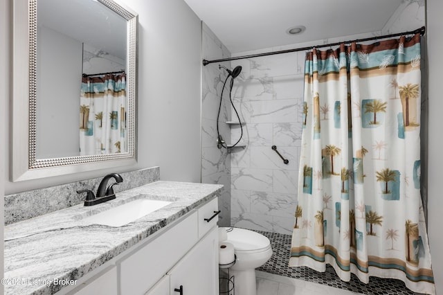 bathroom with vanity, curtained shower, and toilet