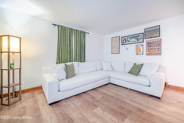 living room with light hardwood / wood-style floors