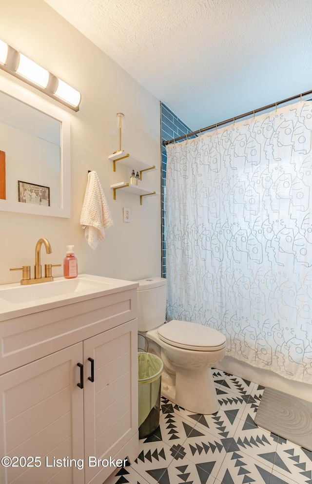 bathroom with vanity, a textured ceiling, toilet, and a shower with shower curtain