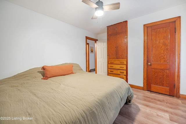 bedroom featuring light hardwood / wood-style floors and ceiling fan