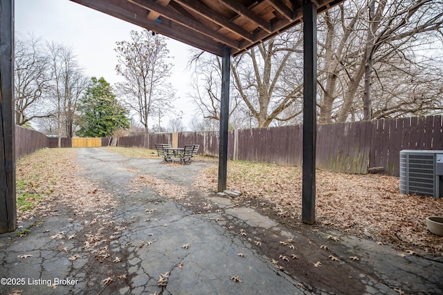 view of yard with a patio area and central air condition unit